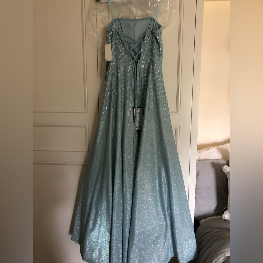 Baby blue cinderella gown from Macy’s. I never got to wear it